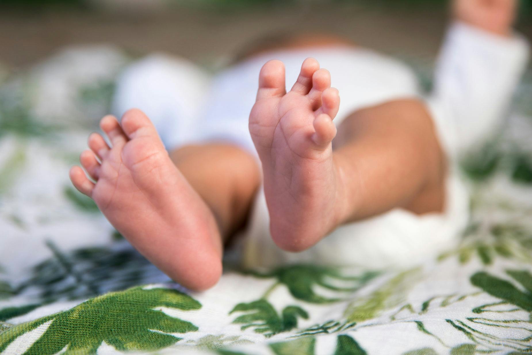 baby feet on a blanket