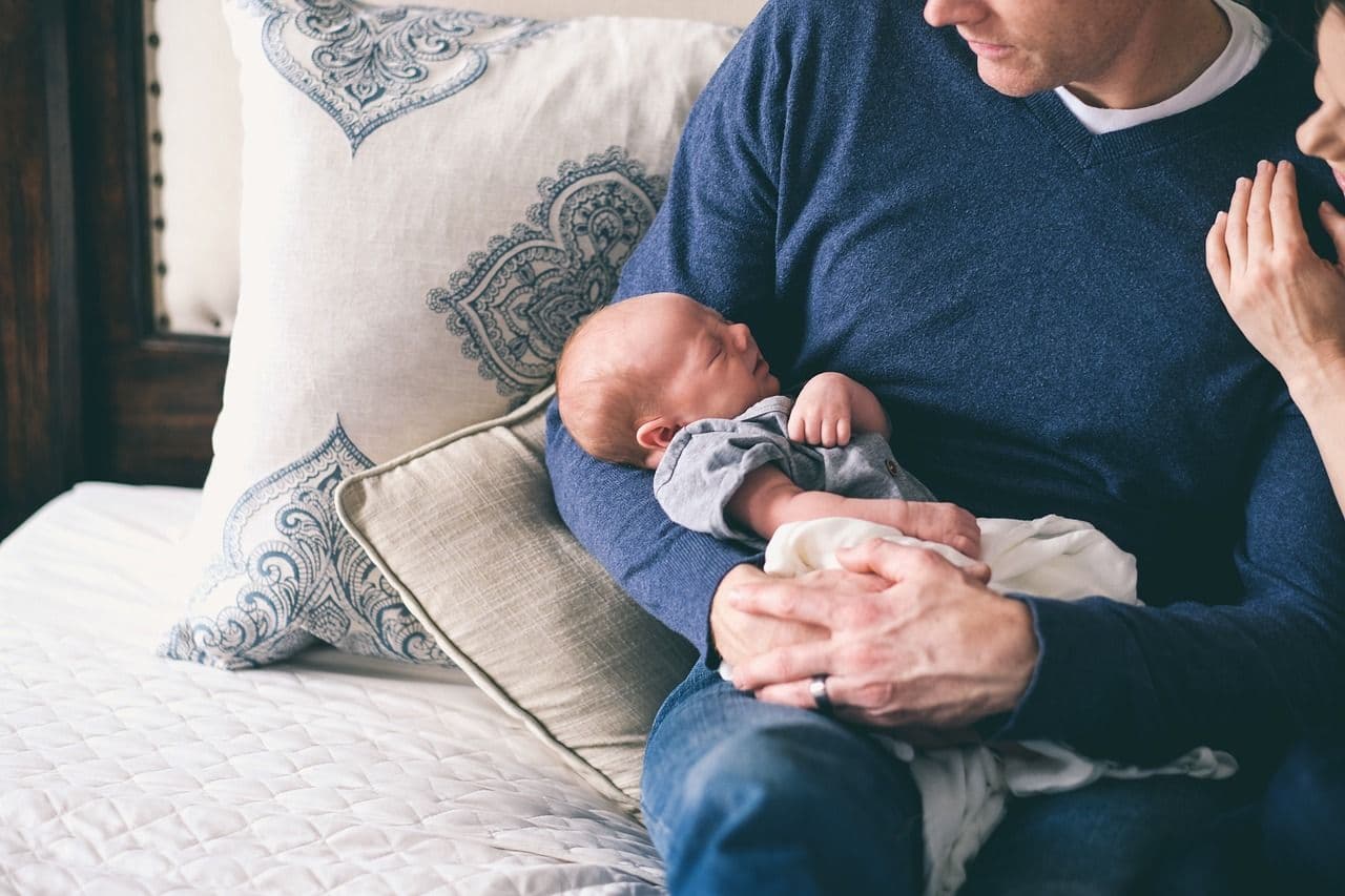 Family resting with their newborn
